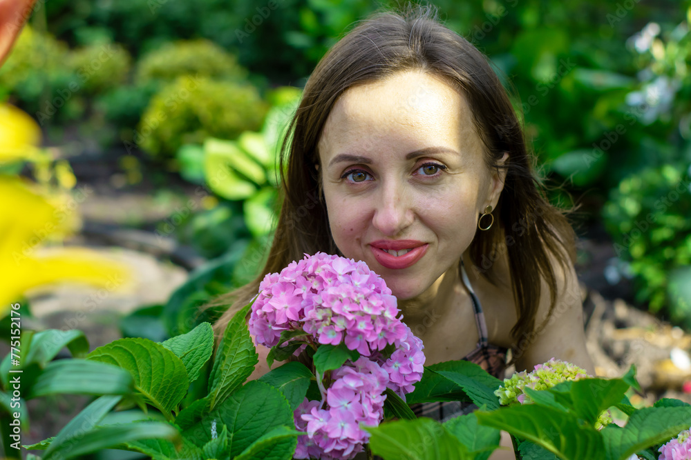 A beautiful woman in her own world of flowers. A beautiful woman in her own world of flowers.