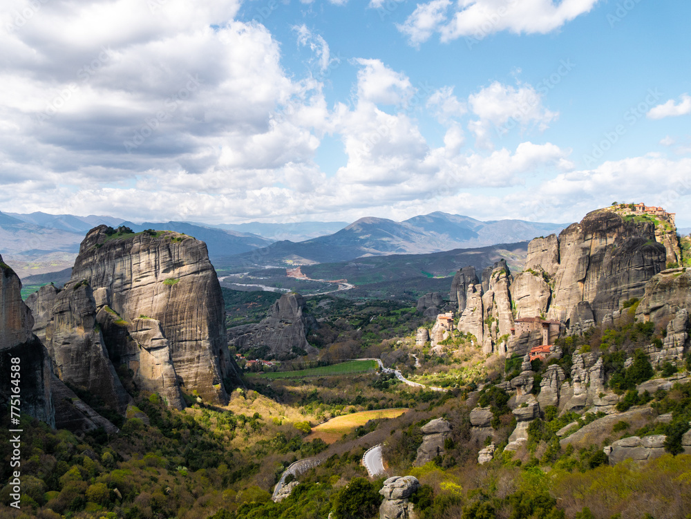 Meteora Monasteries and the surrounding rock formation on a partly cloudy day 13