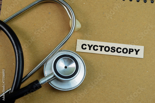 Concept of Cyctoscopy write on sticky notes with stethoscope isolated on Wooden Table. photo