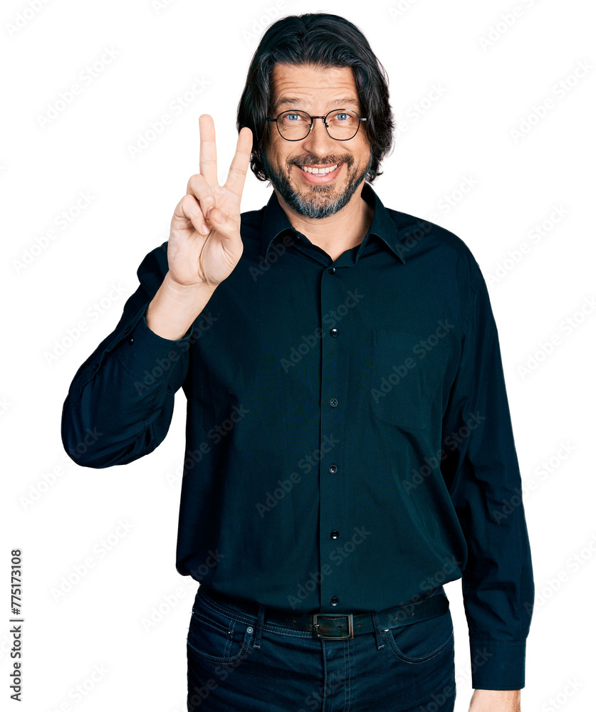 Middle age caucasian man wearing casual clothes and glasses showing and pointing up with fingers number two while smiling confident and happy. Middle age caucasian man wearing casual clothes and glasses showing and pointing up with fingers number two while smiling confident and happy.