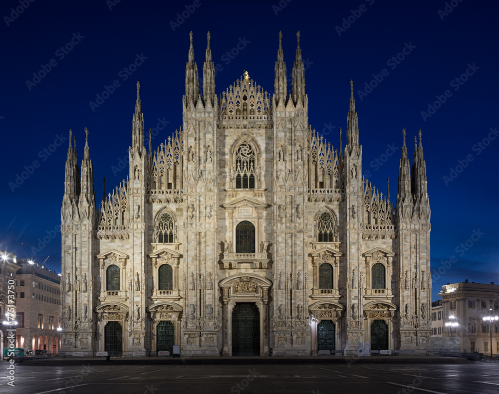 MILAN, ITALY - MARCH 4, 2024:  The westfacade of Duomo - cathedral at dusk
