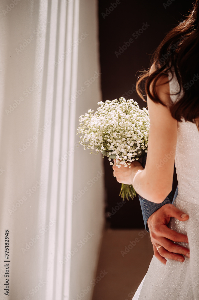 The image shows a woman holding a bouquet of flowers 6763.