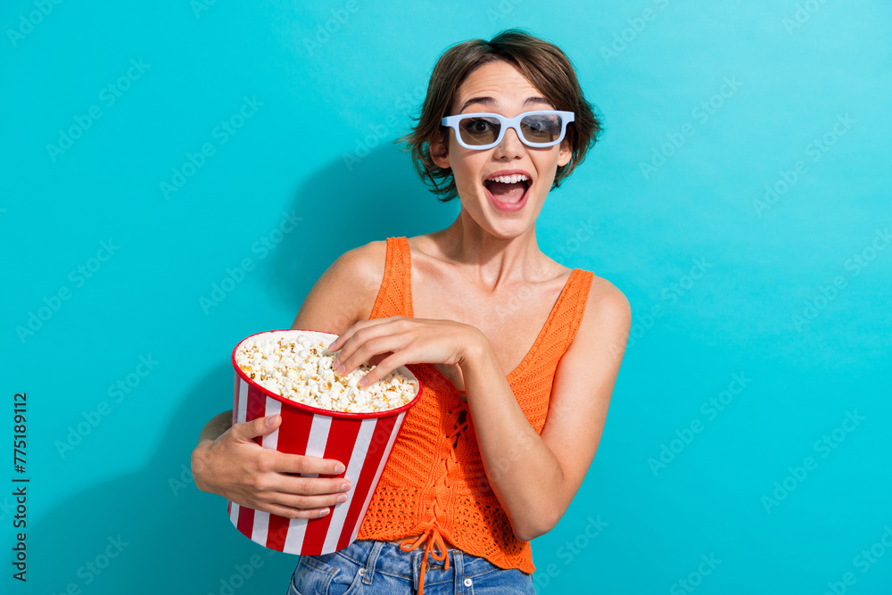Photo of overjoyed woman dressed knitwear singlet in 3d glasses eat popcorn watch excited movie isolated on turquoise color background - obrazy, fototapety, plakaty 
