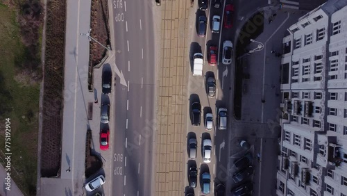 Cars waiting at a red light seen from above