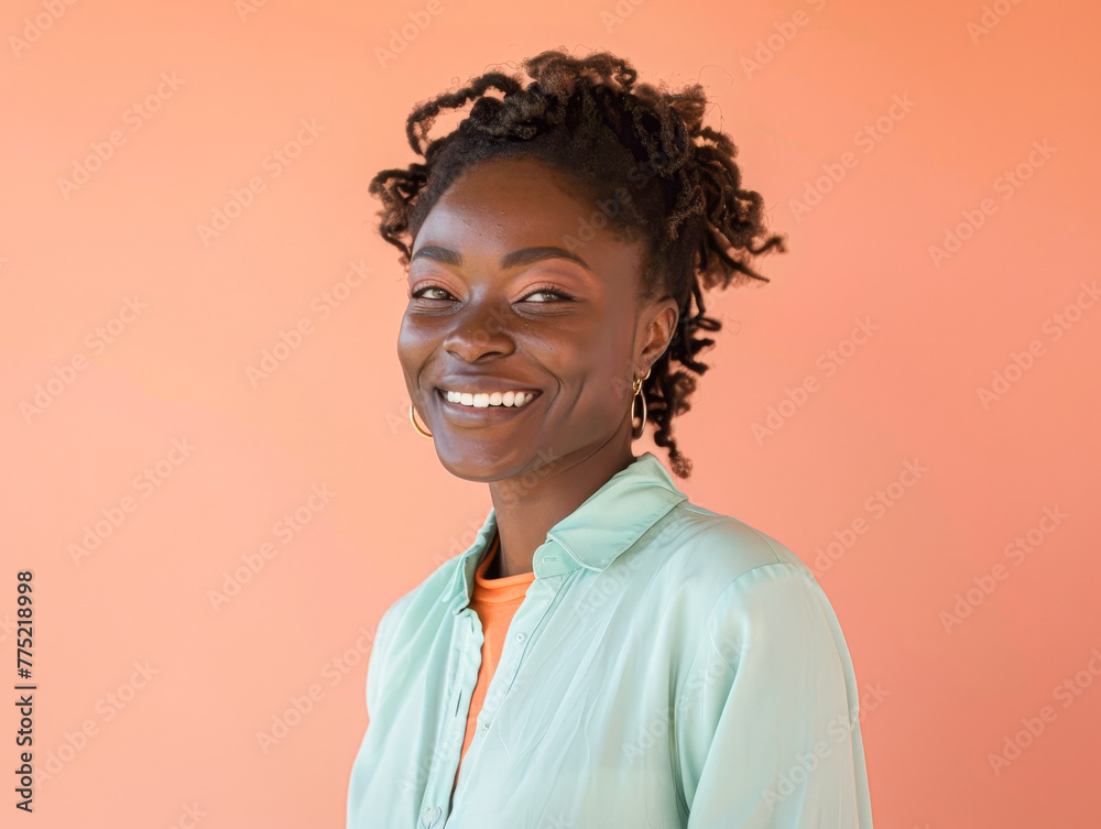 A woman with curly hair and a green shirt is smiling. She is wearing gold earrings. The image has a bright and cheerful mood A woman with curly hair and a green shirt is smiling. She is wearing gold earrings. The image has a bright and cheerful mood