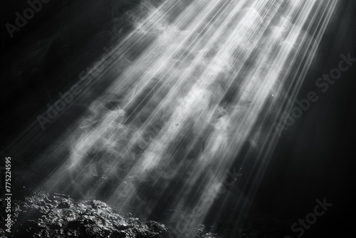 Light in the Darkness: A subtle volumetric ray effect pierces through a dark website background, creating a balanced composition with a sense of mystery.
