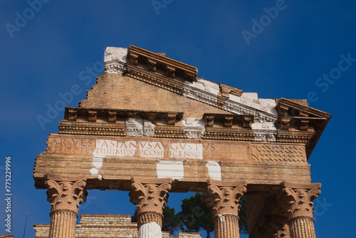 Ruins of Roman Temple in Brescia, Italy. Latin lettering translation: Caesar Vespasian Augustus Pontifex Maximus.Tribunician Power.Tenth Emperor.Father of the Nation.Consul.Censor 