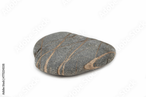 Closeup of gray natural smooth stone with beige stripes isolated on white background