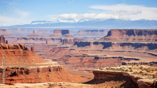 A splendid background of a canyon with desert features and mountain ranges in the horizon