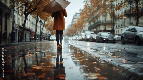 Stylish parisian woman in cinematic rain scene with umbrella, reflecting on the wet streets photo