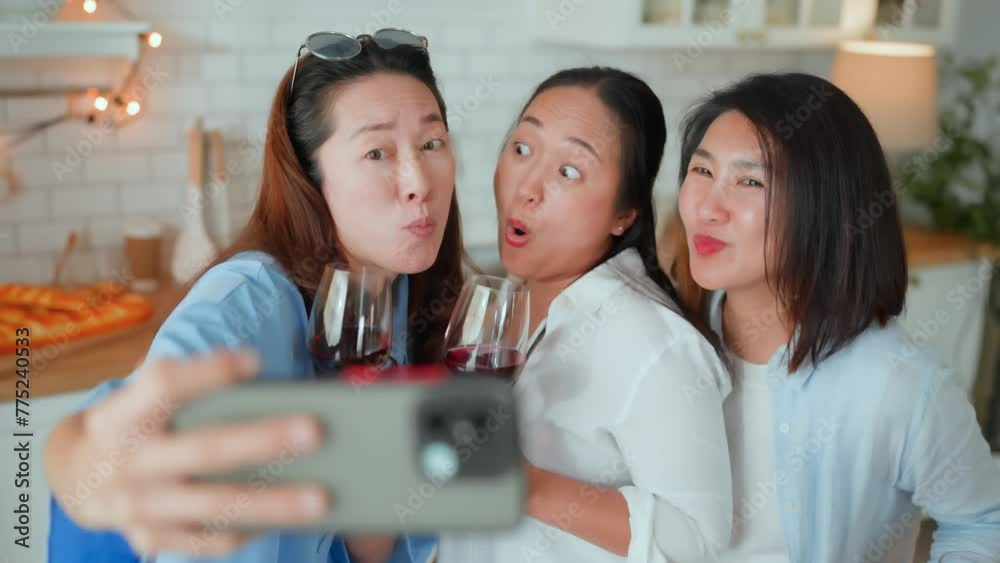 fun smartphone video calling and photo selfie happiness lifestyle group of asian mature adult friendship reunion having a great party at home making a remarkable day selfie and videocall to friend
