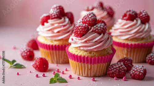 Cupcake Table With Frosting and Raspberries