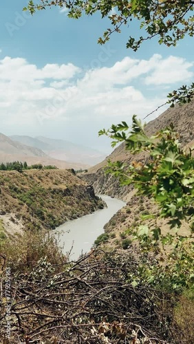 Beautiful Karatag and Piron valleys in the Fan Mountains. Panorama of the deep valley of the Zeravshan River. The Zarafshan and Hissar ranges are located near the mountain village of Aini. Pamir	
 photo