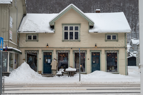 A shop on a Snowy Winter Street in Rjukan with Nordic Architecture