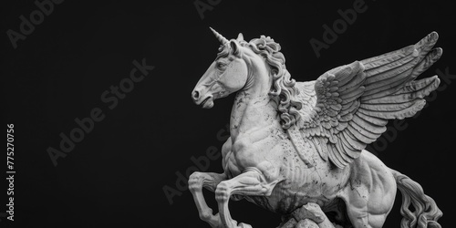 A striking black and white photo of a majestic winged horse statue. Ideal for artistic projects and decor inspiration