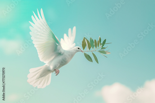 White dove carrying a little olive leaf branch celebrating the World Peace Day celebration