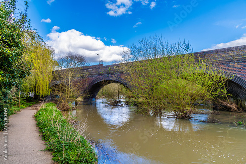 A view along the bank of the River Biam towards the Aylestone viaduct in Leicester, UK in Springtime photo