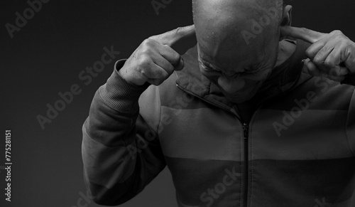 deaf man suffering from deafness and hearing loss on gray background with people stock image stock photo 