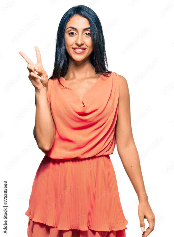 Beautiful hispanic woman wearing summer dress smiling with happy face winking at the camera doing victory sign. number two. Beautiful hispanic woman wearing summer dress smiling with happy face winking at the camera doing victory sign. number two.