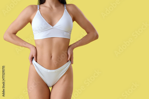 Young woman in white underw...
