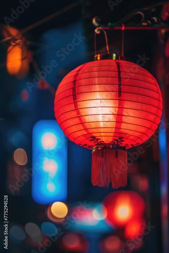 A vibrant red paper lantern hanging from a string. Perfect for adding a pop of color to any setting