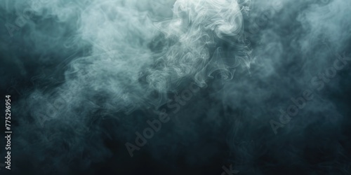 Thick smoke rising against a black backdrop. Suitable for graphic design projects © Fotograf