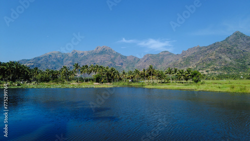 Beautiful lake and mountain range, bright blue sky, Tamil Nadu, India