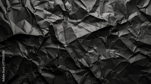 A black and white photo of crumpled paper. Suitable for design projects and artistic backgrounds