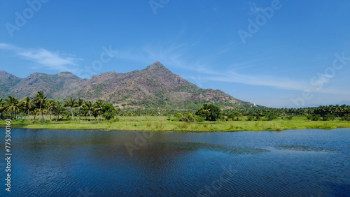 Beautiful lake and mountain range, bright blue sky, Tamil Nadu, India