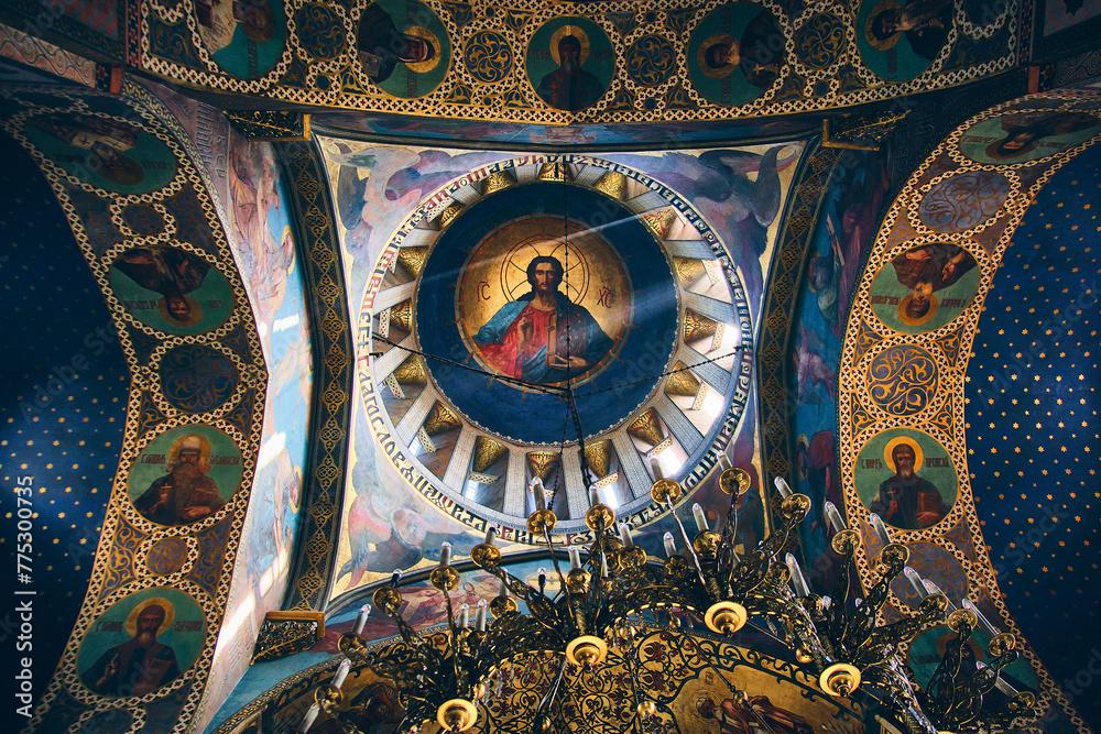 Fototapeta premium Bottom up view of The Sioni Cathedral of the Dormition ceiling. Frescos and chandelier in Georgian Orthodox cathedral in Tbilisi, Georgia