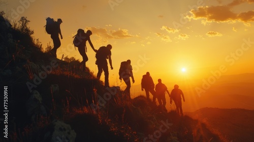 A group of people hiking up a hill during sunset. Suitable for outdoor and adventure themes