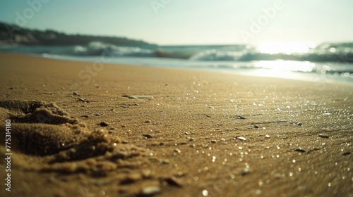 Footprints in the sand on a beach near the ocean. Suitable for travel brochures