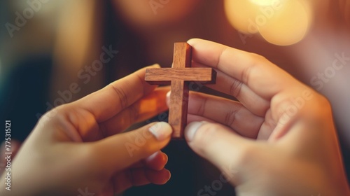 Christianity hands holding religious cross. Pray to god. Person praying in church concept.