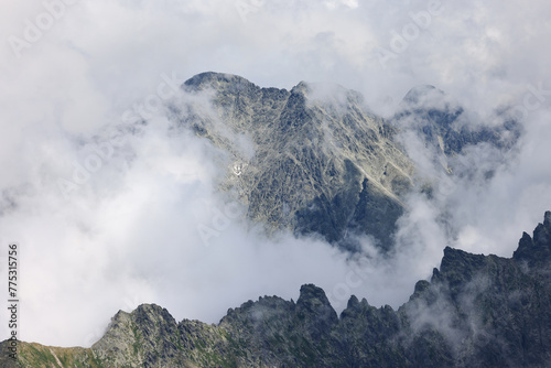 Fototapeta Naklejka Na Ścianę i Meble -  Slovak Tatra Mountains in the clouds on a sunny day in summer.