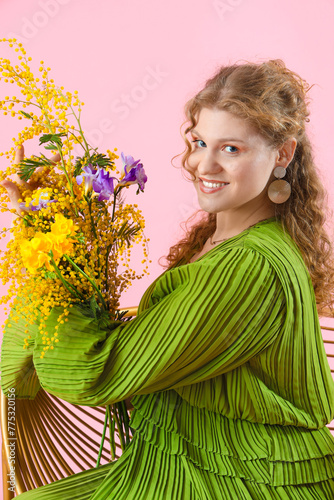 Pretty young woman with bou...