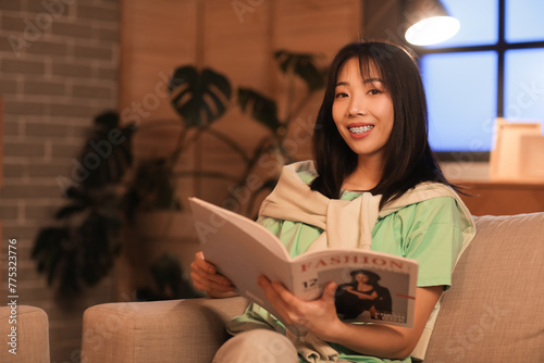 Young Asian woman reading m...