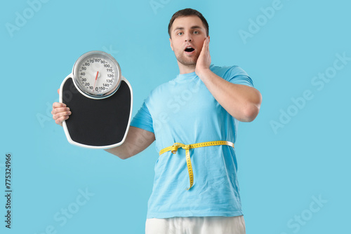 Shocked young man with tape...