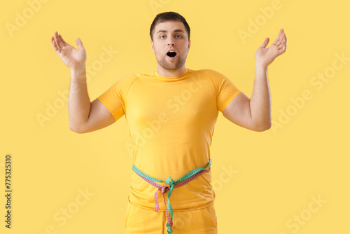 Shocked young man with meas...