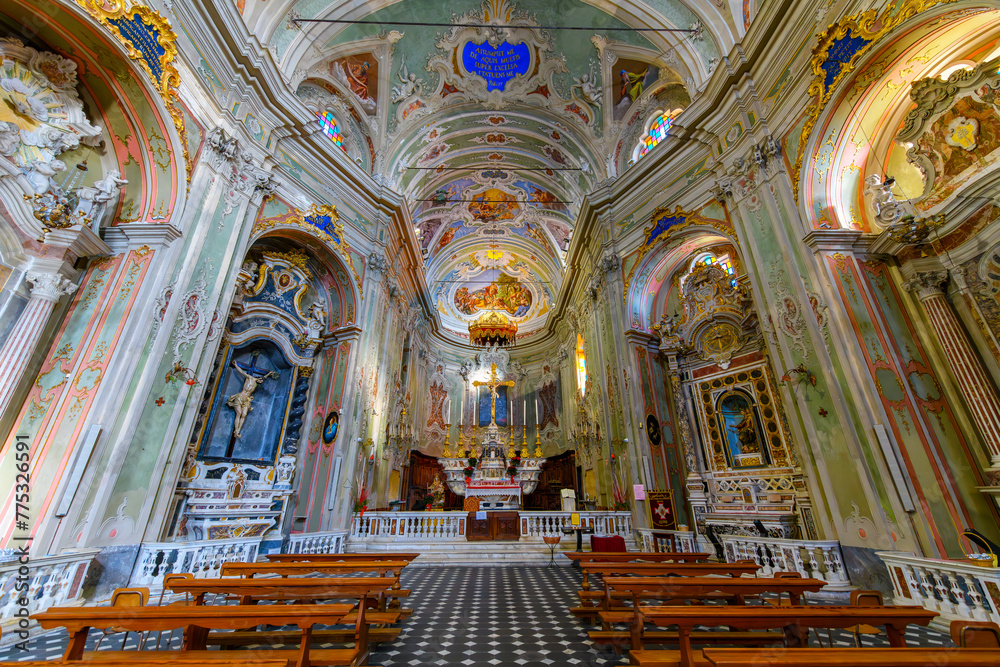 Ornate interior of the 17th century Church of San Giovanni Battista in the hilltop town of Cervo, Italy, along the Mediterranean coast of the Imperia, Liguria region.