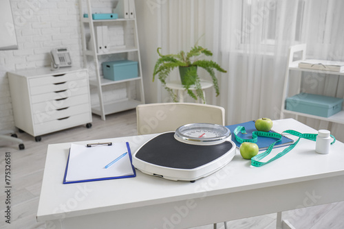 Weight scales with apples a...