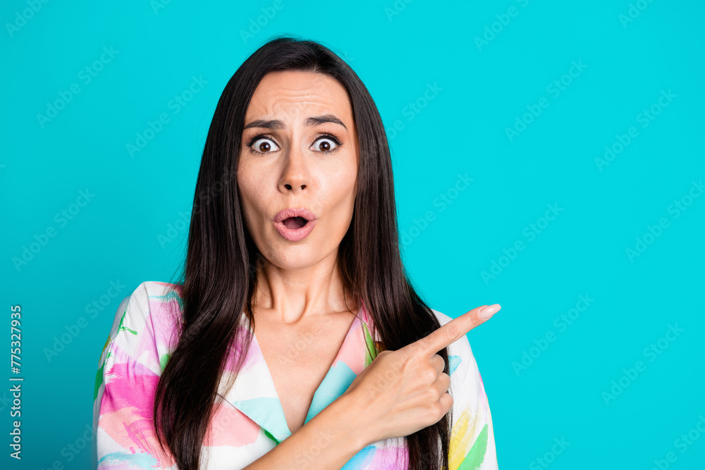 Photo of nice lady open mouth point finger empty space wear shirt isolated on turquoise color background Photo of nice lady open mouth point finger empty space wear shirt isolated on turquoise color background