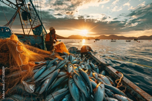 fishing boat full of fish nets at sunrise photo