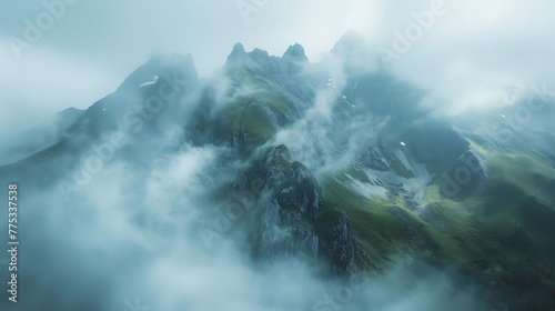 drama of alpine clouds rolling over mountain summits