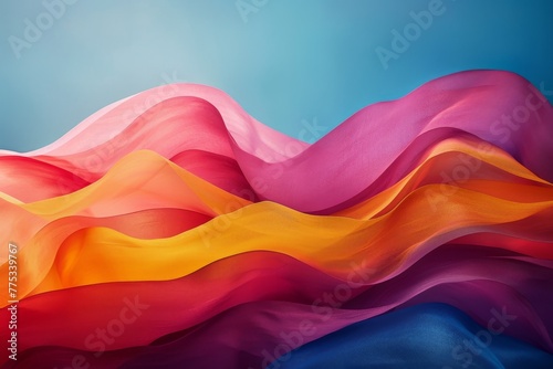 Vibrant Multicolored Fabrics Flowing Gracefully Against a Blue Background