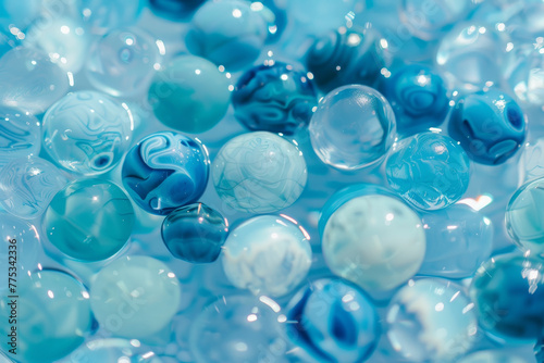 A bunch of blue and white marbles are floating in a blue liquid