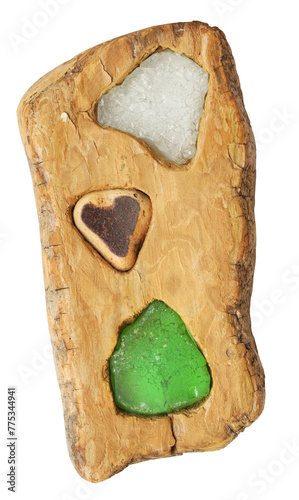 Driftwood decoration with sea glass isolated on a white background.