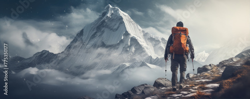 Tourist hiking in snowy mountains. Man with climbing accessories dressed high warm mountaineering clothes. copy space for text.