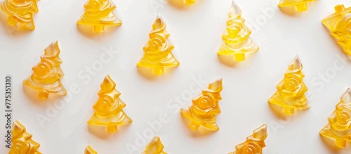 Many various gummy bears on a white surface photo
