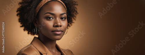 African American 25-30 Years Woman Isolated On A Amber Background With Copy Space