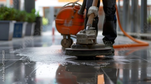 Worker polishing exterior walkway with industrial machine and cleaning solution